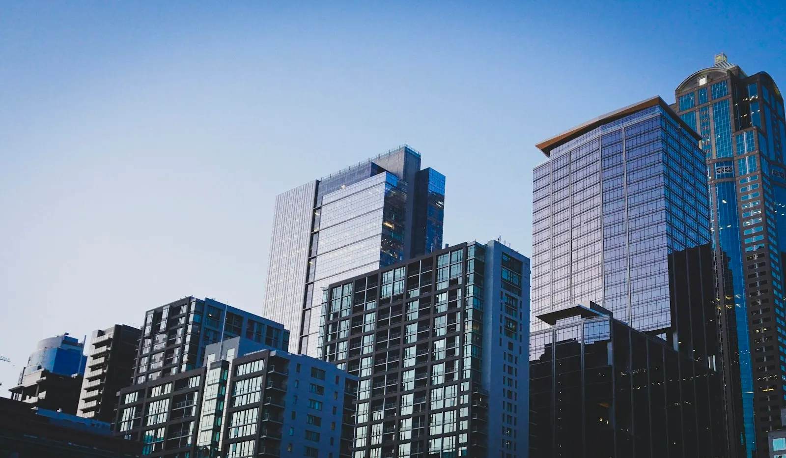 Glass and concrete high rise buildings viewed from below